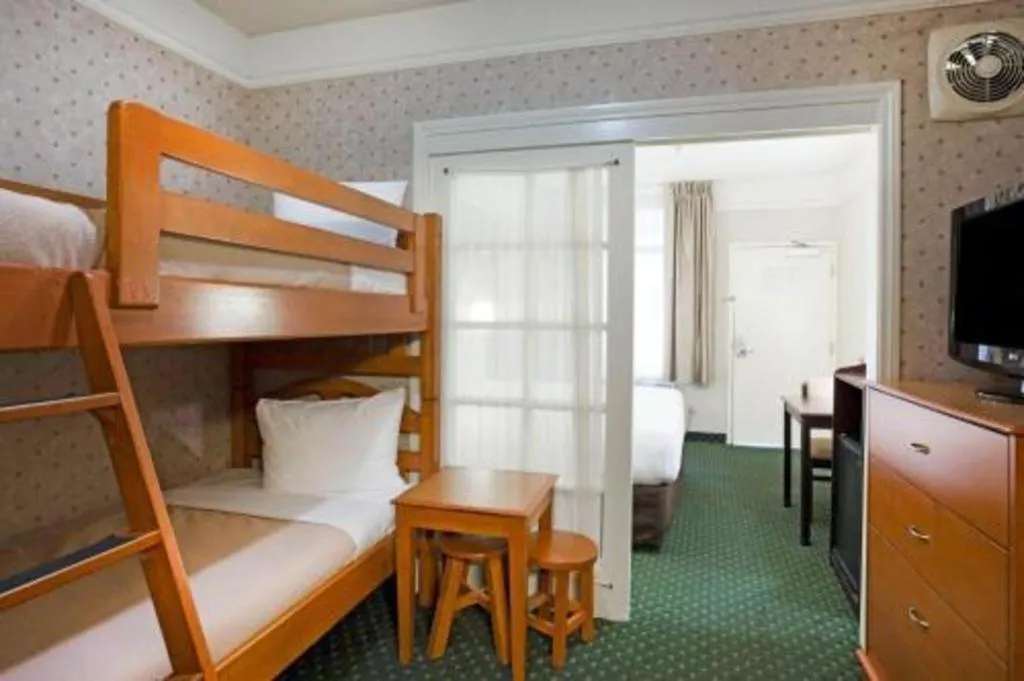 Bed in Ramada Suites by Wyndham San Diego