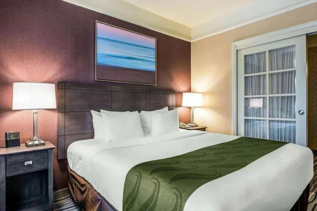 Bed in Ramada Suites by Wyndham San Diego