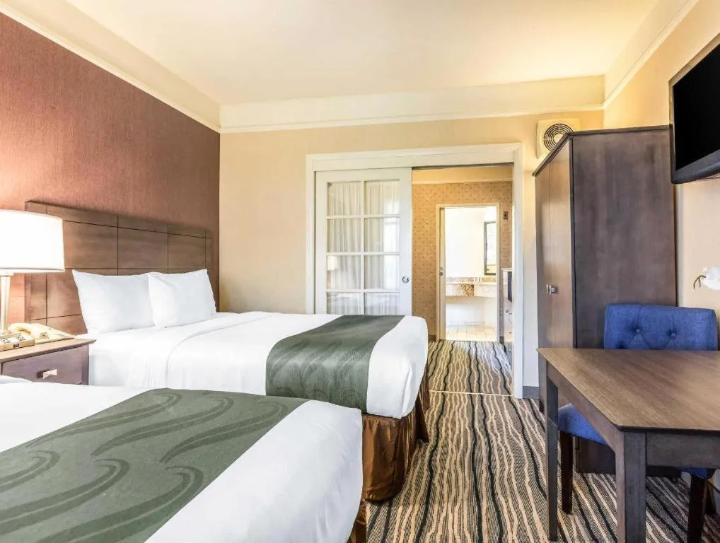 Bed in Ramada Suites by Wyndham San Diego