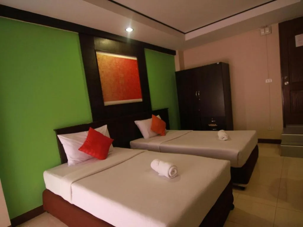 Bed in Grand Pinnacle Hotel