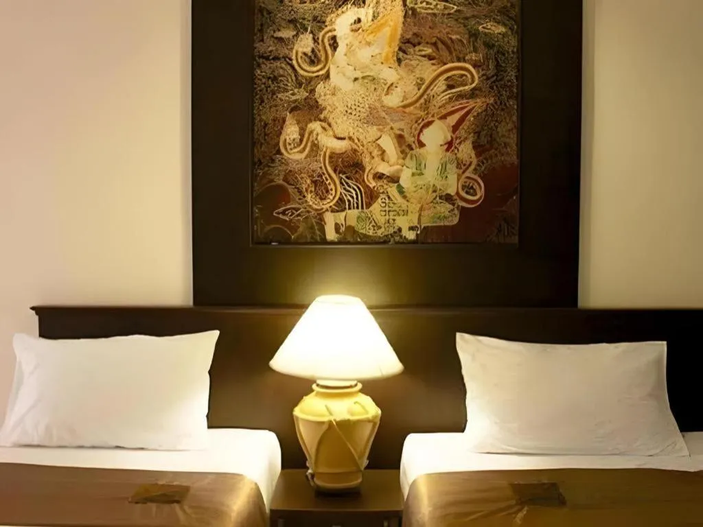 Bed in Grand Pinnacle Hotel