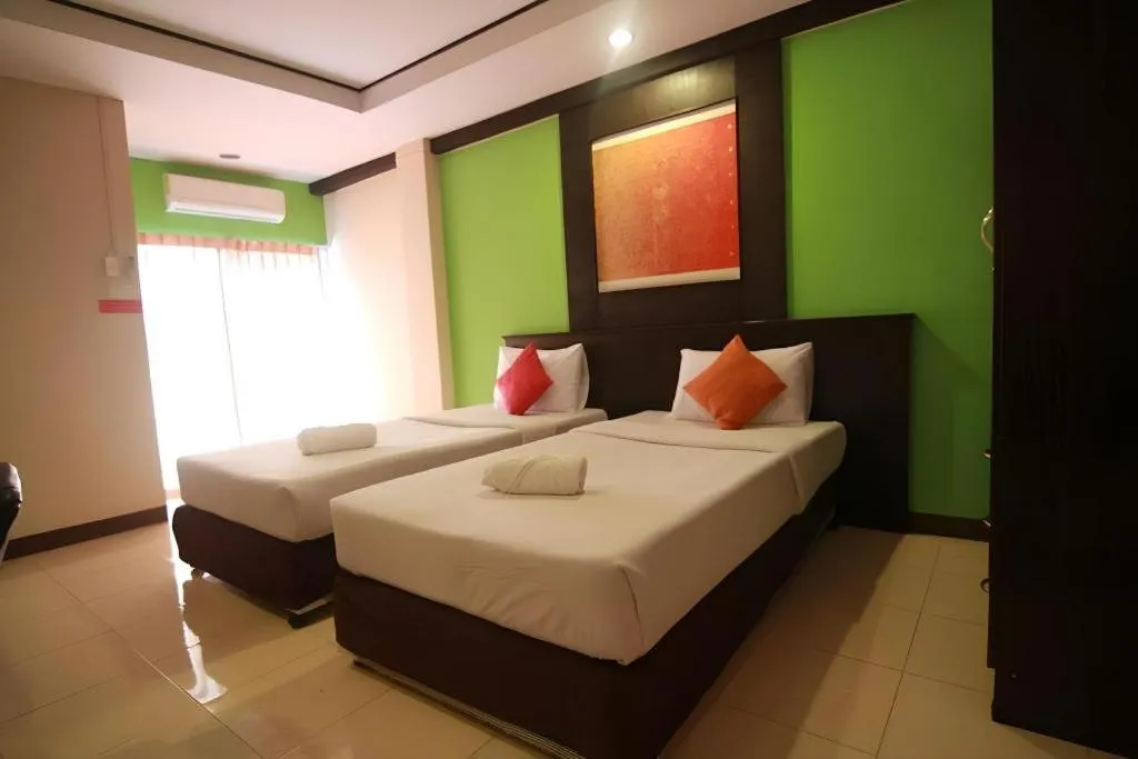 Bed in Grand Pinnacle Hotel