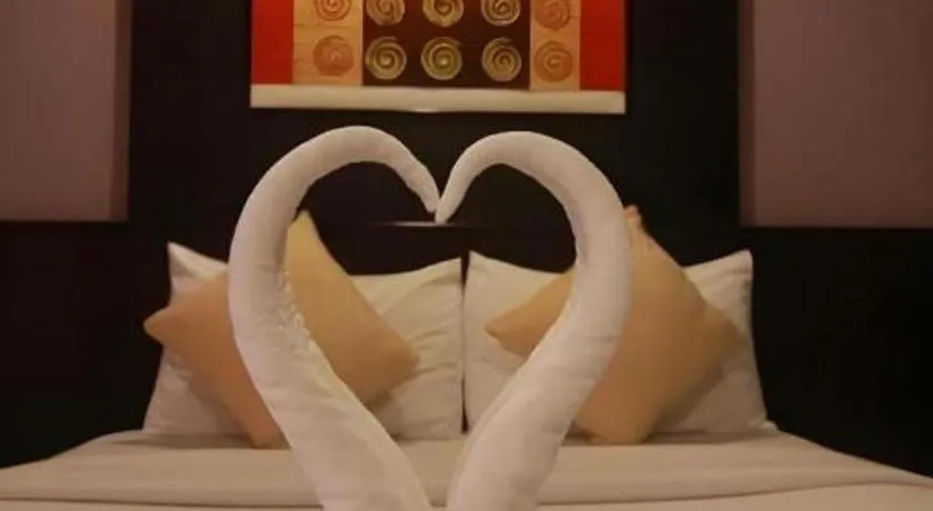 Bed in Grand Pinnacle Hotel