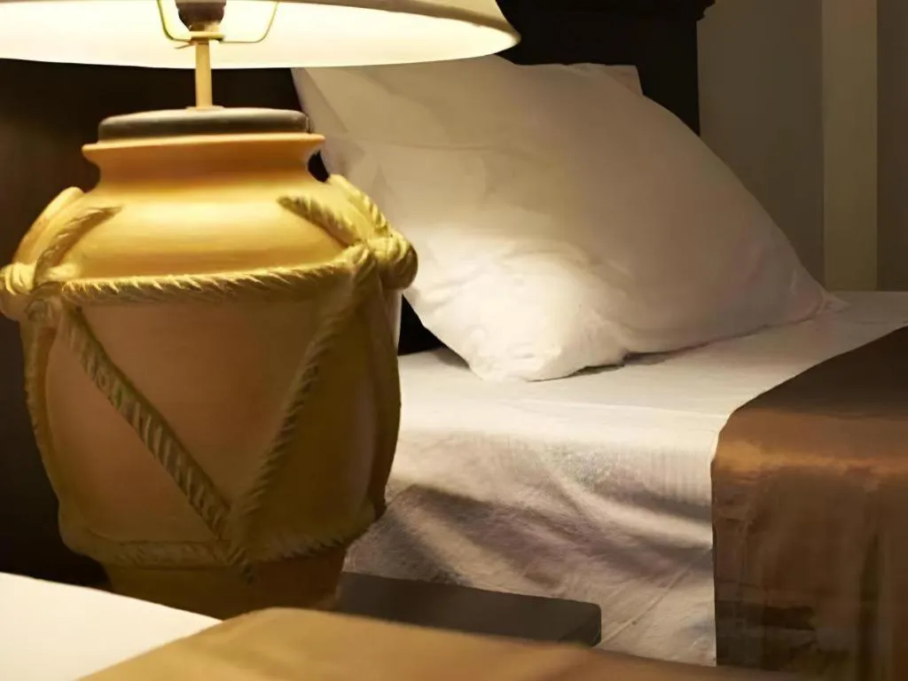 Bed in Grand Pinnacle Hotel