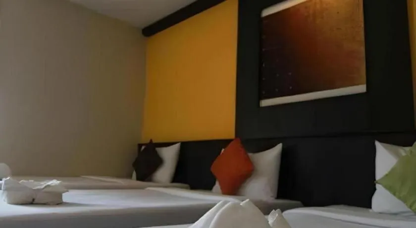 Bed in Grand Pinnacle Hotel