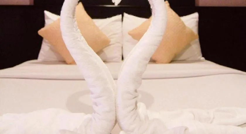 Bed in Grand Pinnacle Hotel