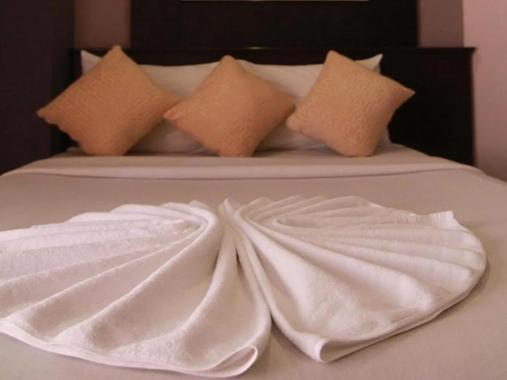 Bed in Grand Pinnacle Hotel