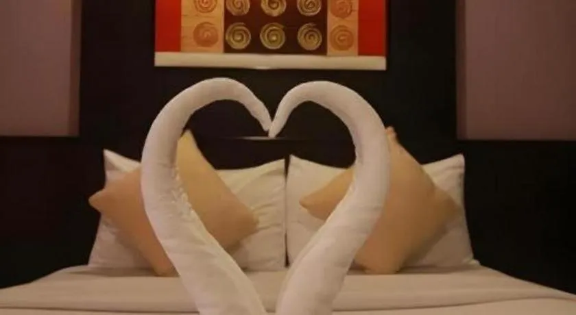 Bed in Grand Pinnacle Hotel