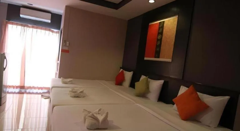 Bed in Grand Pinnacle Hotel