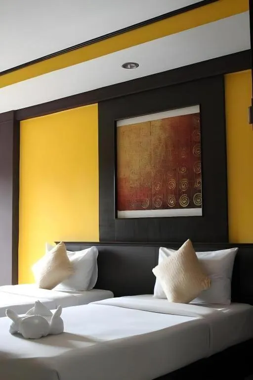 Bed in Grand Pinnacle Hotel