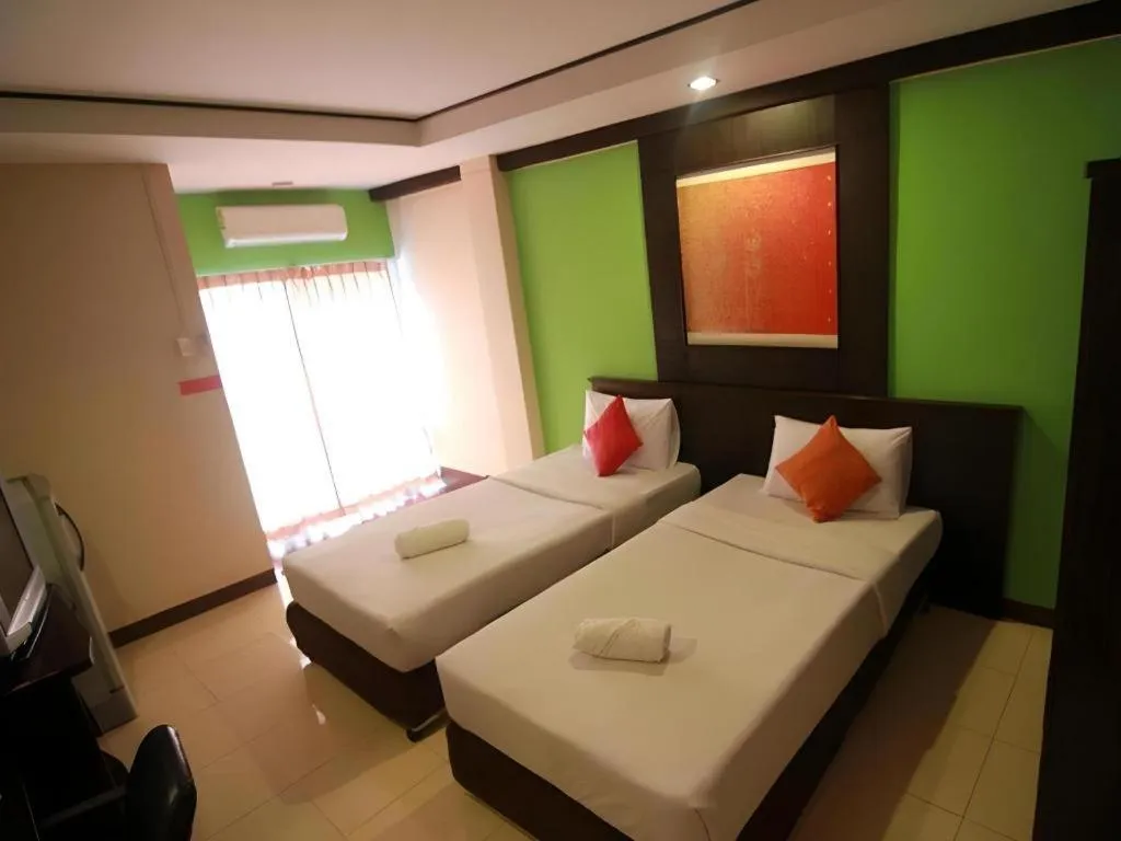 Bed in Grand Pinnacle Hotel