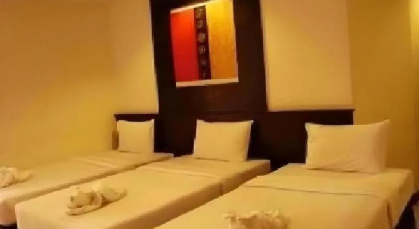 Bed in Grand Pinnacle Hotel