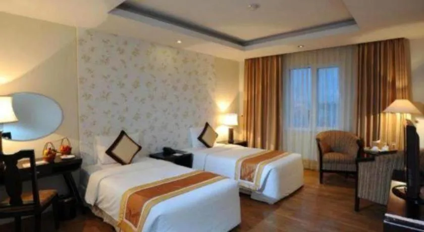 Bed in Cosiana Hotel