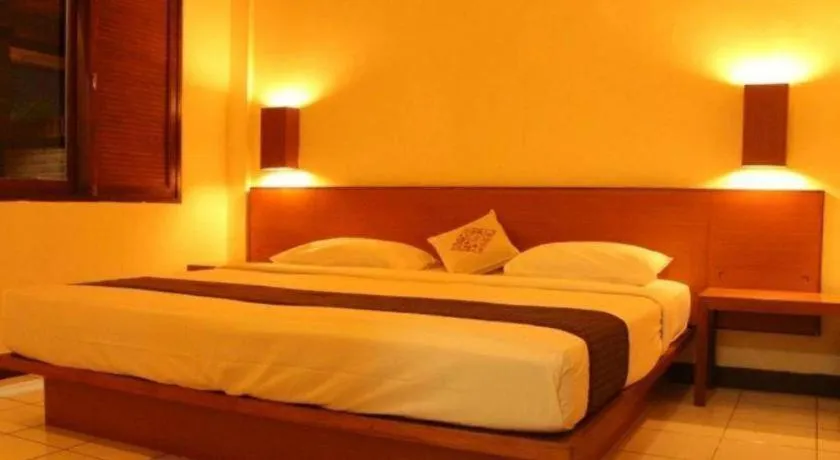 Bed in Nyiur Resort Hotel