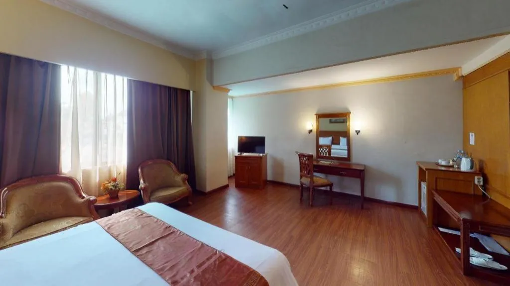 Bed in Madani Hotel Medan