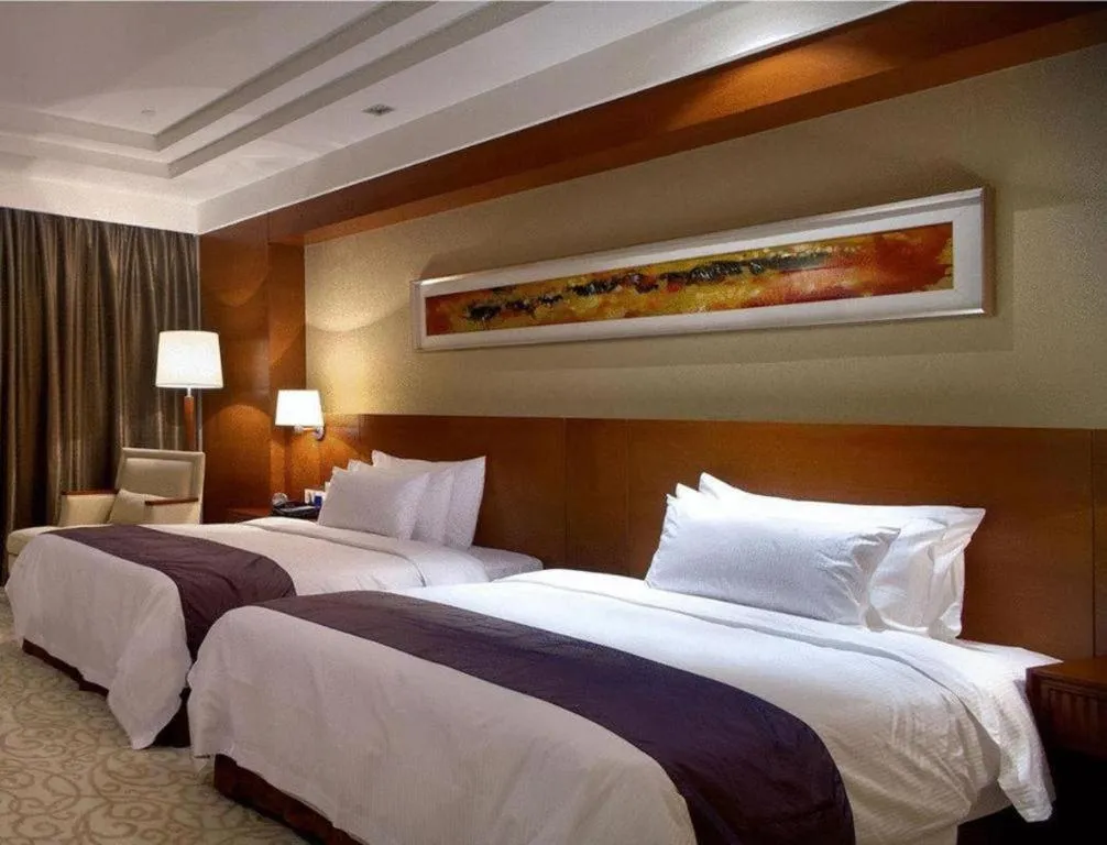 Bed in New Century Grand Hotel Ninghai Jinhai