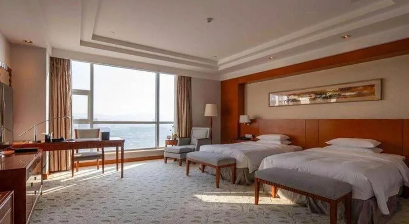 Bed in New Century Grand Hotel Ninghai Jinhai