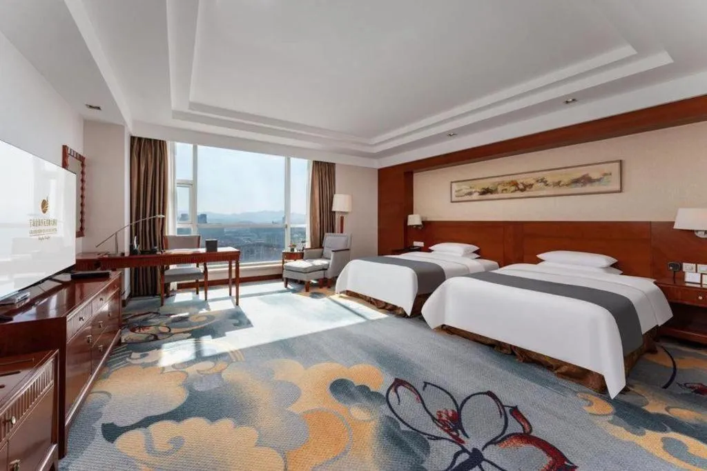 Bed in New Century Grand Hotel Ninghai Jinhai