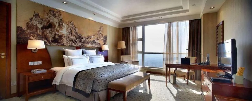 Bed in New Century Grand Hotel Ninghai Jinhai