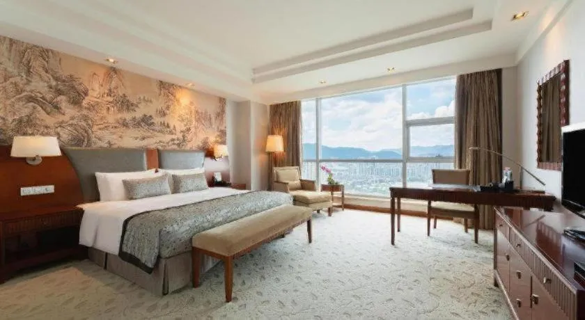 Bed in New Century Grand Hotel Ninghai Jinhai