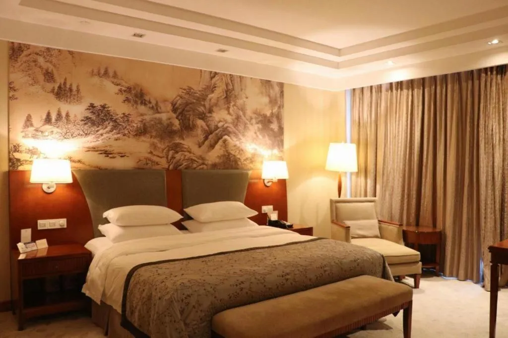 Bed in New Century Grand Hotel Ninghai Jinhai