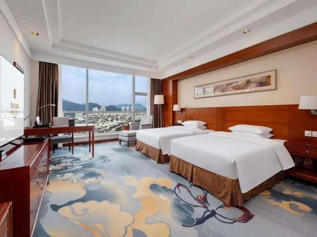 Bed in New Century Grand Hotel Ninghai Jinhai