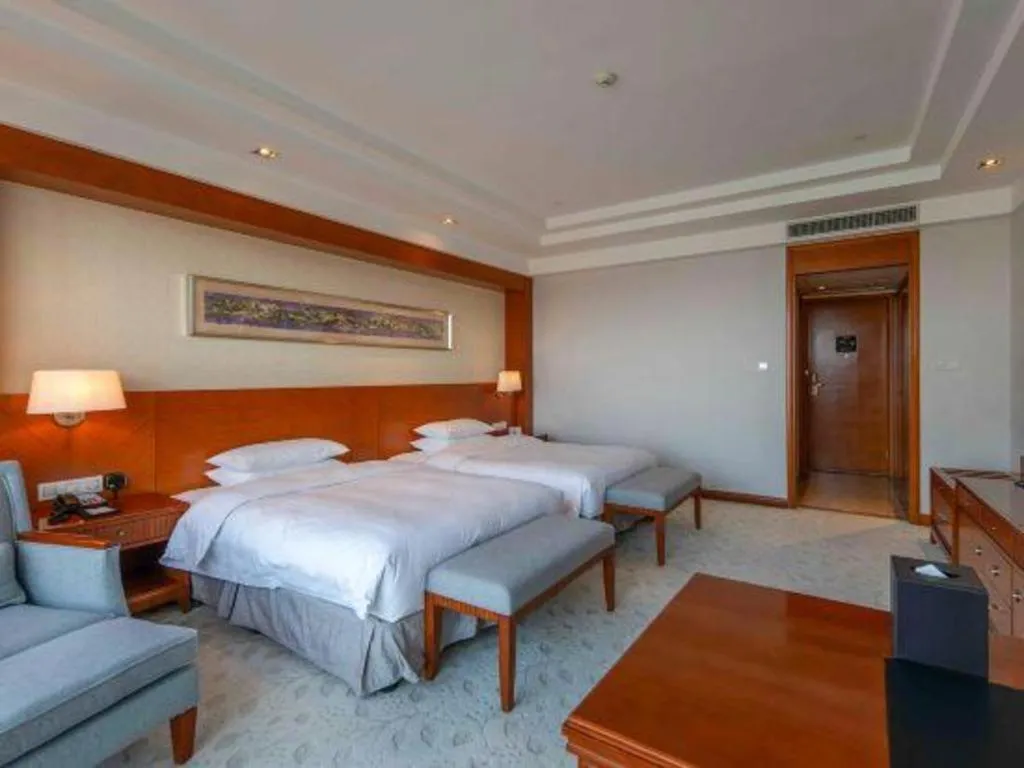 Bed in New Century Grand Hotel Ninghai Jinhai