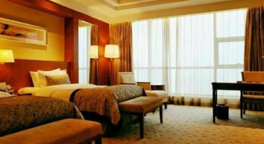 Bed in New Century Grand Hotel Ninghai Jinhai