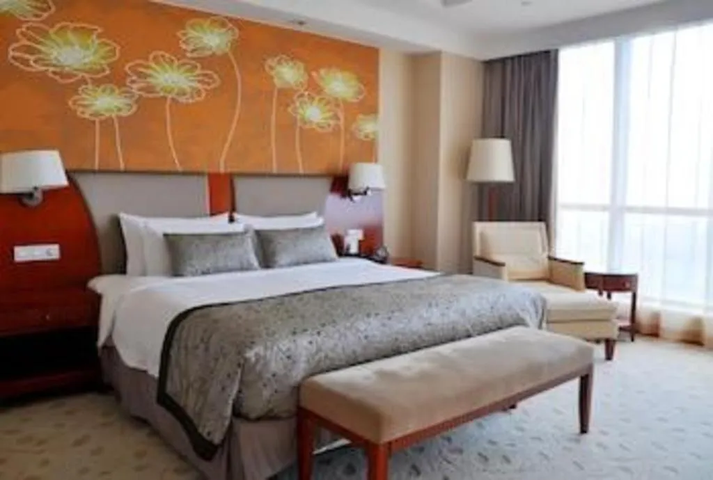 Bed in New Century Grand Hotel Ninghai Jinhai