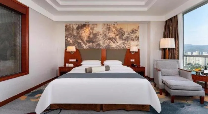 Bed in New Century Grand Hotel Ninghai Jinhai