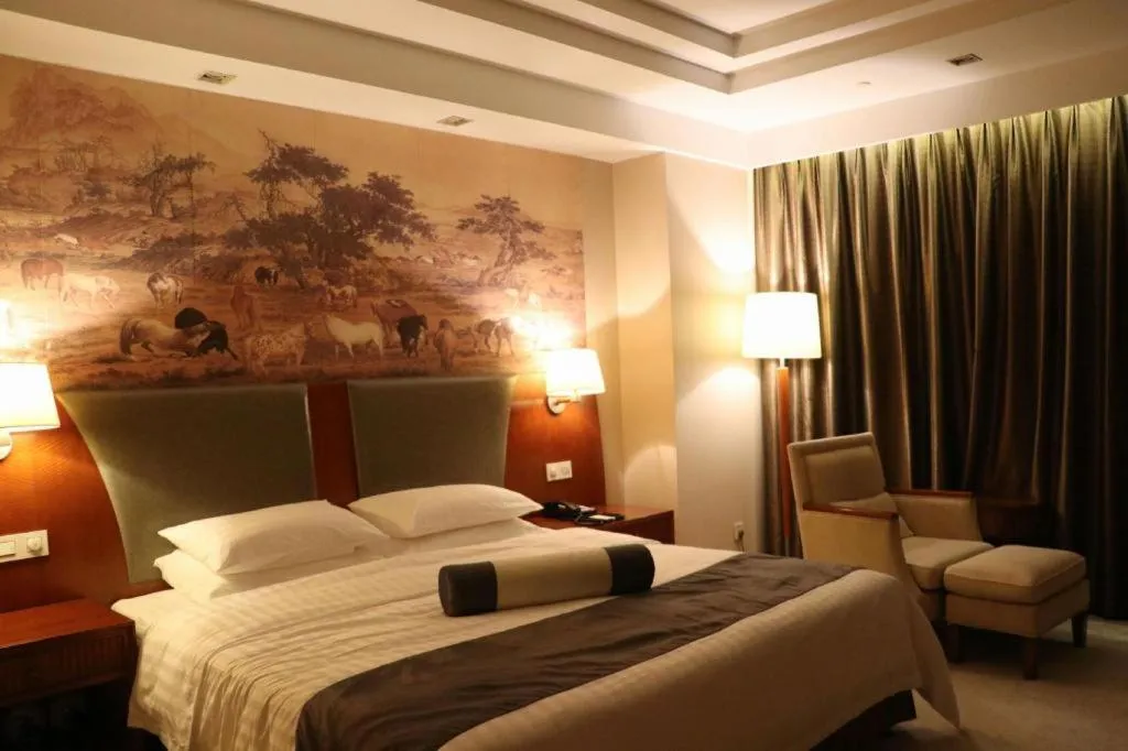 Bed in New Century Grand Hotel Ninghai Jinhai