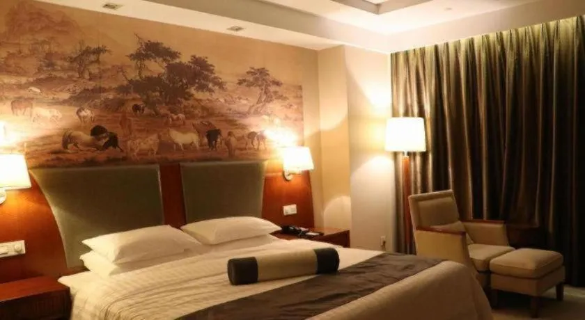 Bed in New Century Grand Hotel Ninghai Jinhai