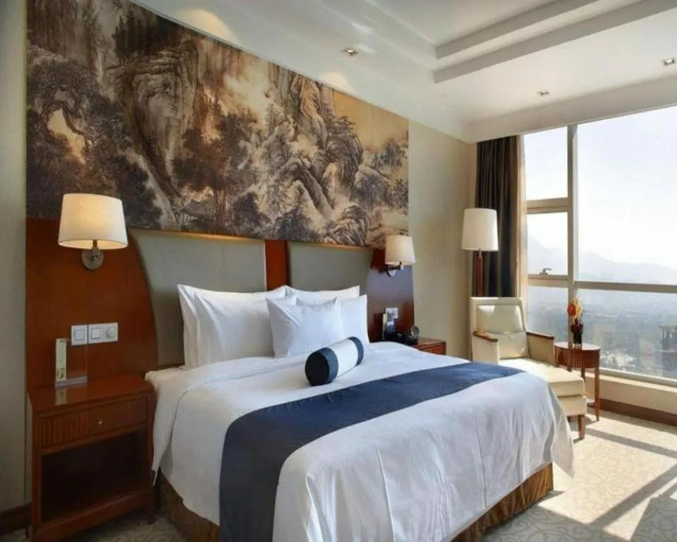 Bed in New Century Grand Hotel Ninghai Jinhai
