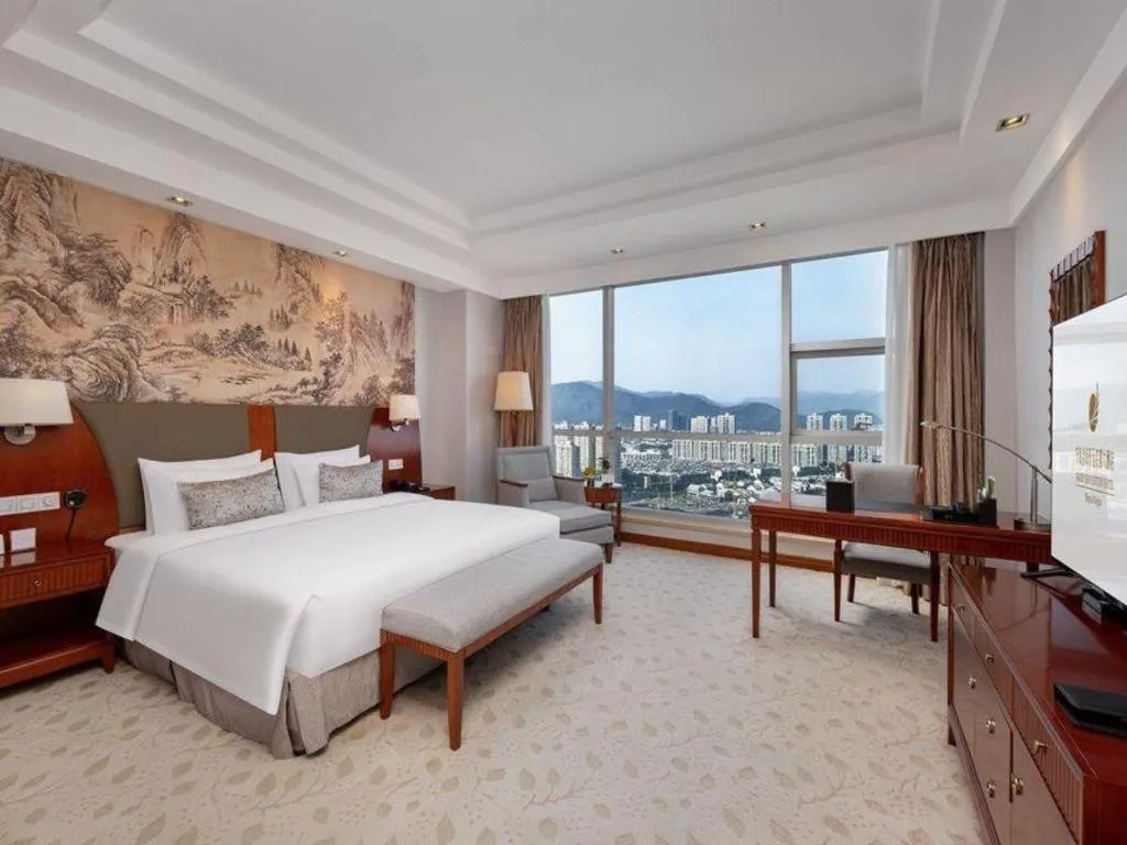 Bed in New Century Grand Hotel Ninghai Jinhai
