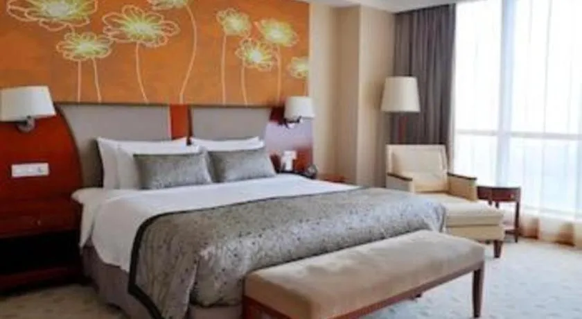 Bed in New Century Grand Hotel Ninghai Jinhai