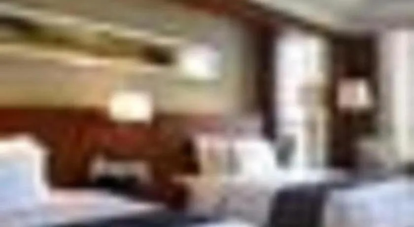 Bed in New Century Grand Hotel Ninghai Jinhai