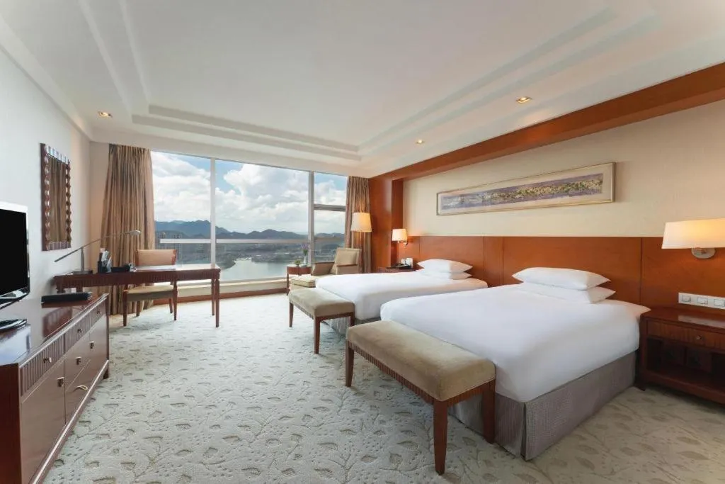 Bed in New Century Grand Hotel Ninghai Jinhai