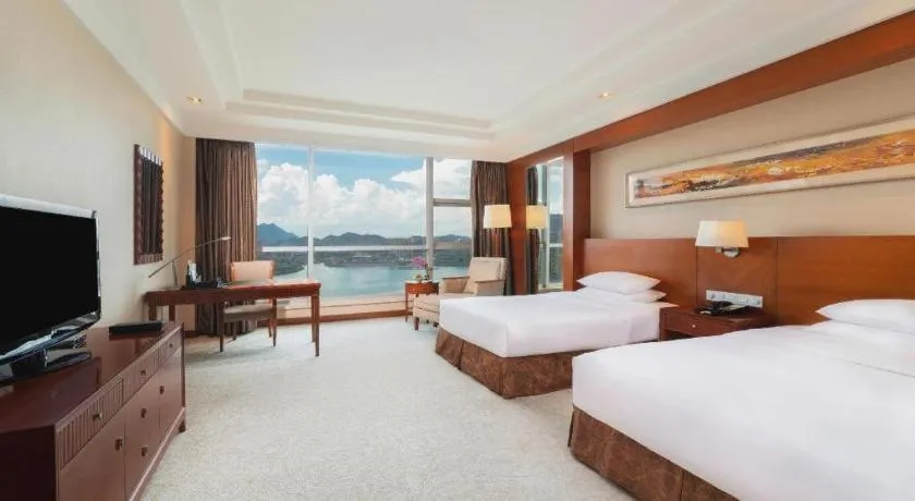 Bed in New Century Grand Hotel Ninghai Jinhai