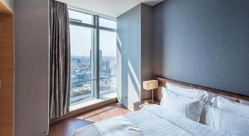 Bed in Grand Madison Qingdao Harbour-view Central（Former Qingdao Farglory Hotel）
