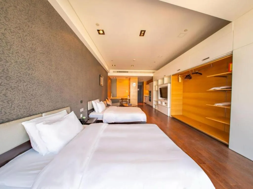 Bed in Grand Madison Qingdao Harbour-view Central（Former Qingdao Farglory Hotel）