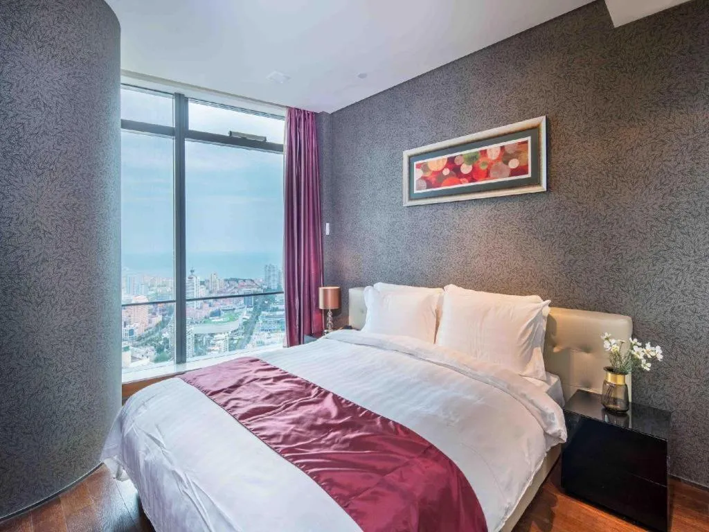 Bed in Grand Madison Qingdao Harbour-view Central（Former Qingdao Farglory Hotel）