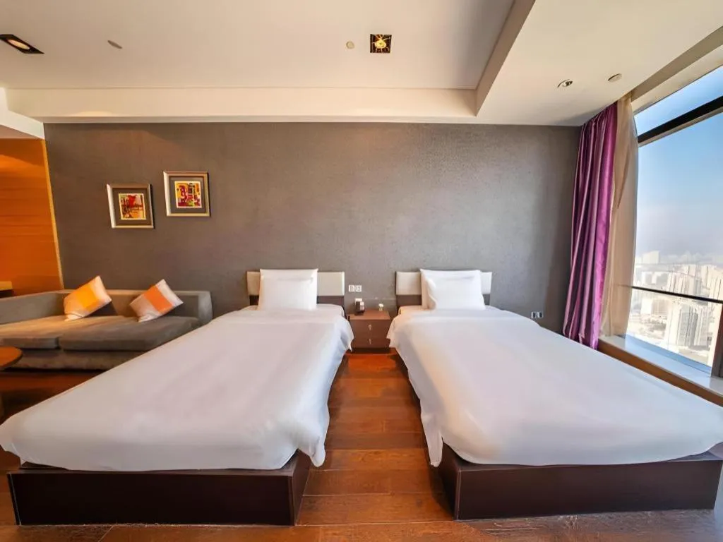 Bed in Grand Madison Qingdao Harbour-view Central（Former Qingdao Farglory Hotel）