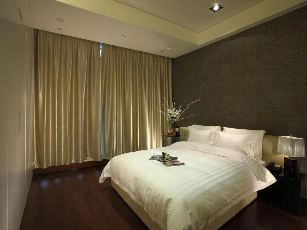 Bed in Grand Madison Qingdao Harbour-view Central（Former Qingdao Farglory Hotel）