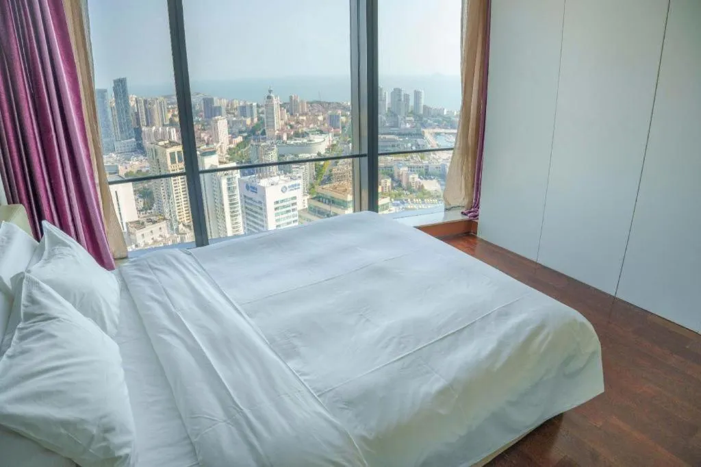 Bed in Grand Madison Qingdao Harbour-view Central（Former Qingdao Farglory Hotel）