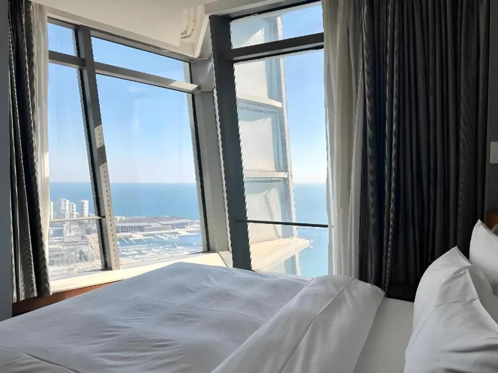 Bed in Grand Madison Qingdao Harbour-view Central（Former Qingdao Farglory Hotel）