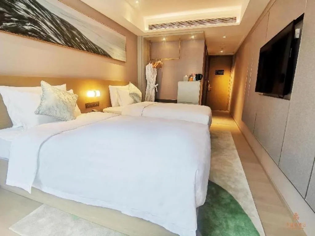 Bed in Kecheng Holiday Hotel