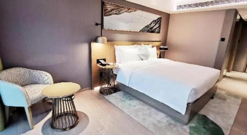 Bed in Kecheng Holiday Hotel