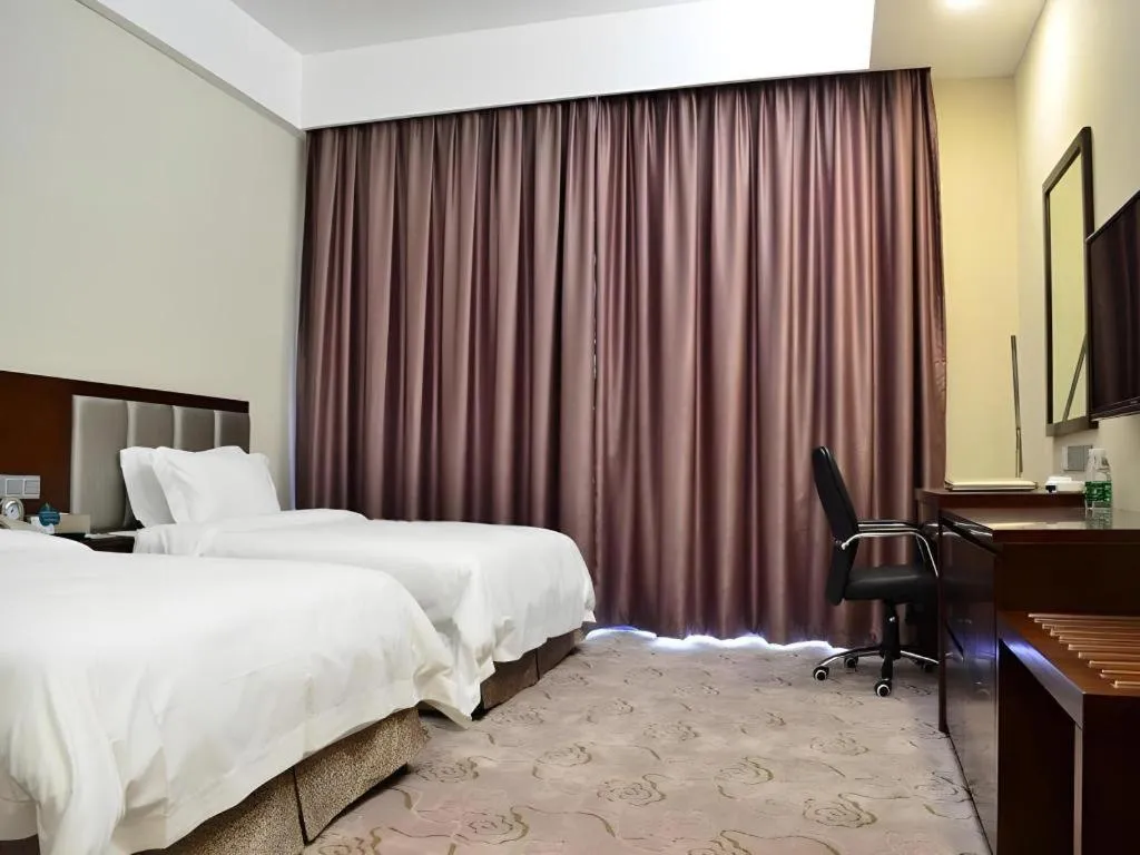 Bed in Kecheng Holiday Hotel