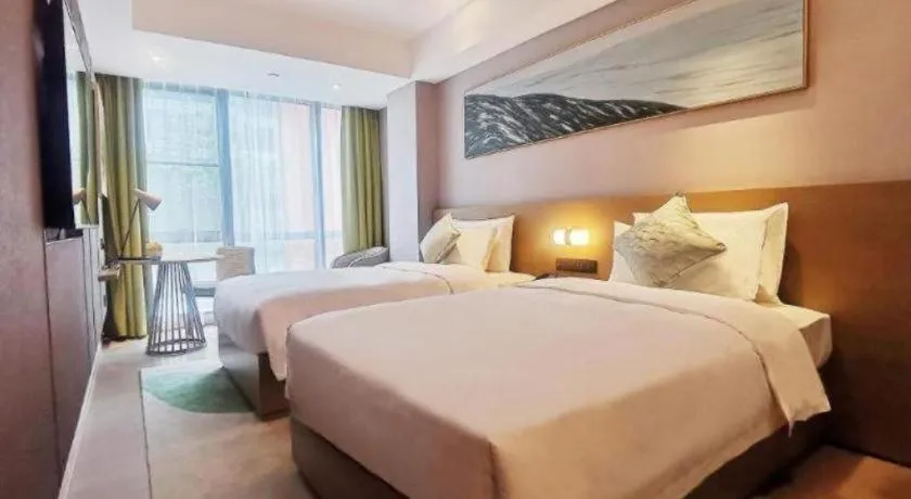 Bed in Kecheng Holiday Hotel