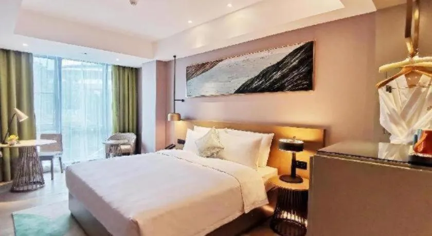 Bed in Kecheng Holiday Hotel